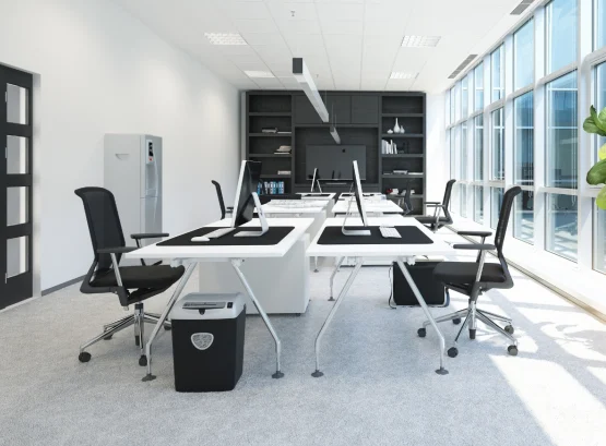 Painter and Decorator in Dublin transforming a modern open-plan office with fresh white paint, natural light, and elegant décor.